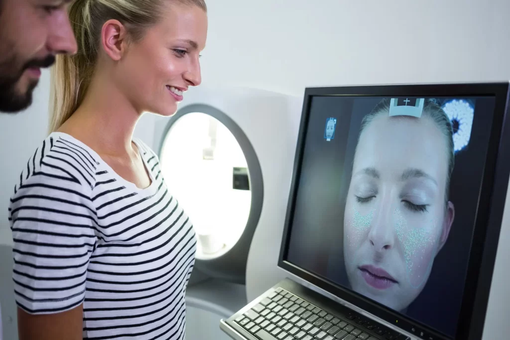 Woman looking at screen doing Skin Analysis